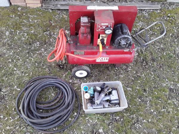 Air compressor with extra hose plus bin of tools and fittings.jpg